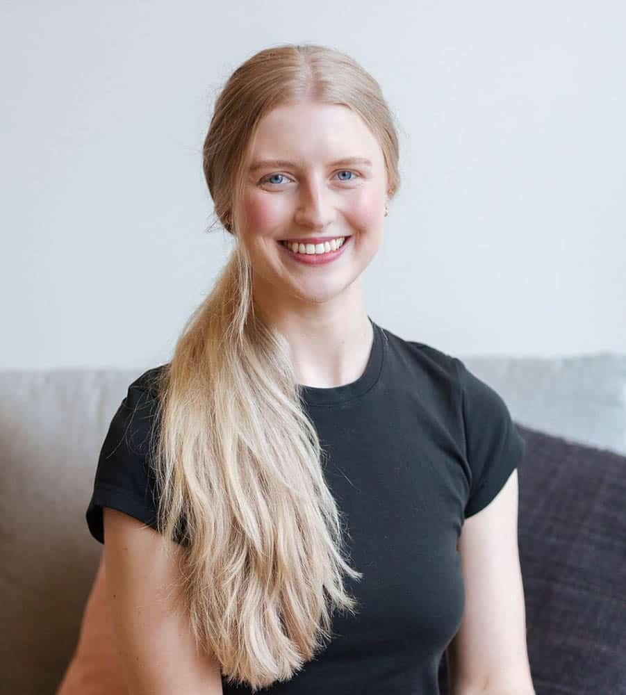 Danni Hinchcliffe smiling at the camera wearing a black top.